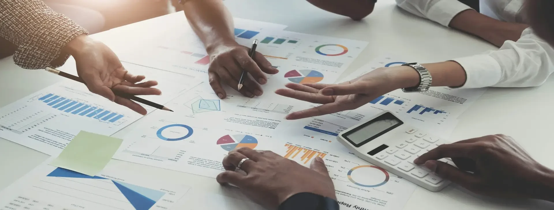Team of business people working together in the meeting room off